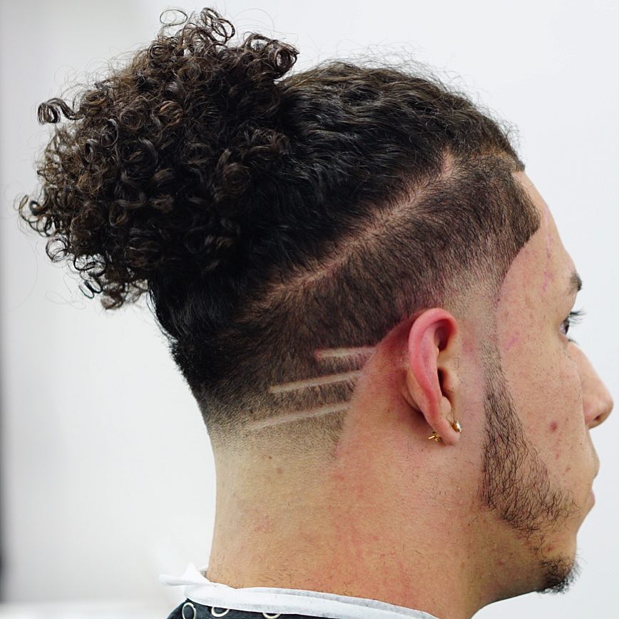 criztofferson curly hair man bun shaved lines mens haircuts