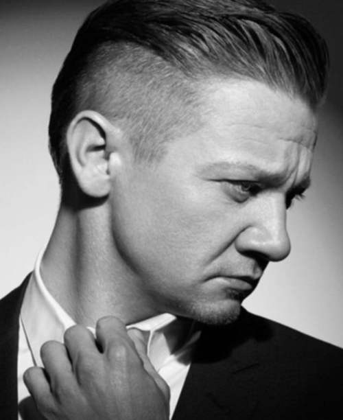 jeremy renner slicked back hairstyle side fade haircut