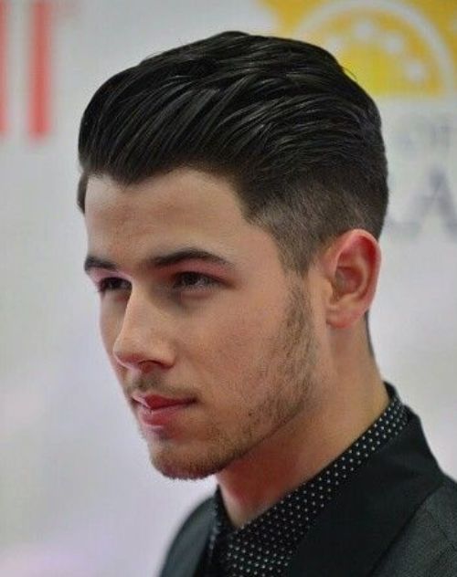 2 nick jonas slicked back high textured hairstyle with side part short