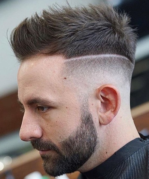 high textured spiky hairstyle with razor line up haircut