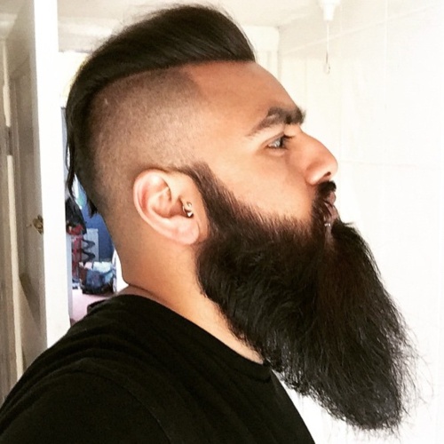 short pompadour slicked back undercut with long men beard style