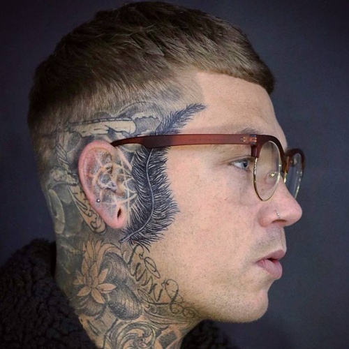 side part low fade skin hairstyle tattoo