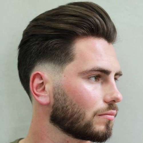 slicked back comb side part burst fade haircut