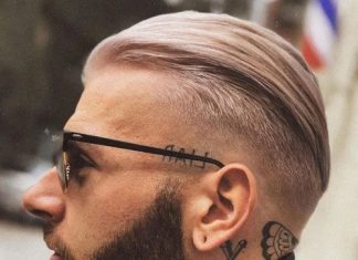 slicked back undercut side part fade men