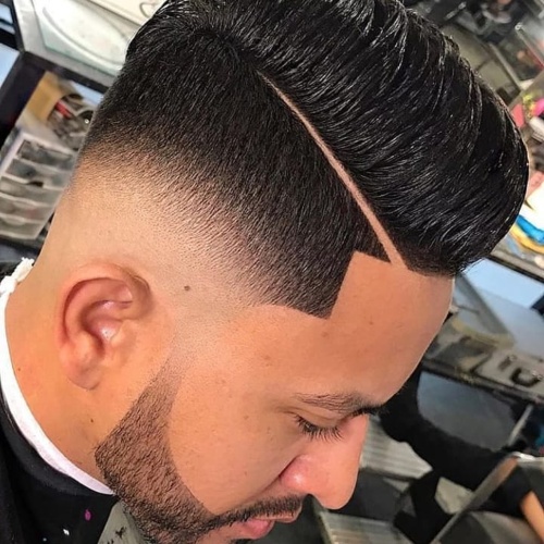 slicked back undercut line up low fade style