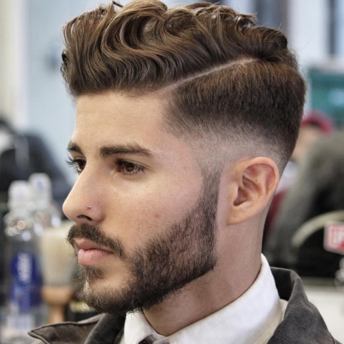 wavy quiff high textured side part fade men's hairstyle